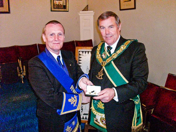 Ramsay McGhee is presented with Gold Masonic Cufflinks in honour of his five years as RWPGM